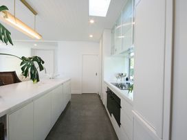 A kitchen with a countertop and stove at New Plymouth Holiday Home in New Plymouth