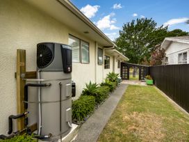 An outdoor area featuring a water heater and plants at Napier Holiday Home in Napier