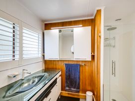 A bathroom with a sink and shower at Napier Holiday Home in Napier
