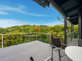 An outdoor space with deck furniture at JD'S Place - Akaroa Holiday Home in Akaroa