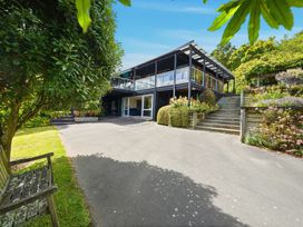 A house with stairs and garden at JD'S Place - Akaroa Holiday Home, Akaroa
