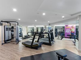 A gym with exercise equipment at a fitness center in Auckland