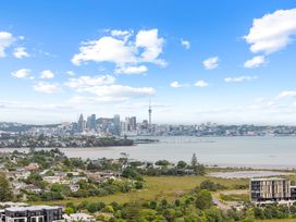 A city skyline with waterfront and greenery at Auckland