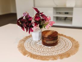 A table with a flower vase and coaster set at New Plymouth