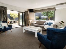 A living room with a sofa and coffee table at New Plymouth in New Plymouth