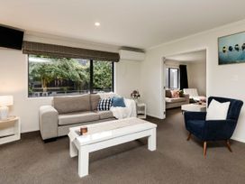 A living room with a sofa and coffee table at New Plymouth in New Plymouth