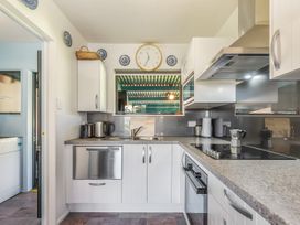 A kitchen with appliances and countertop at Casa Verde - Mapua Holiday Home in Mapua
