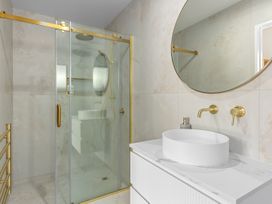 A bathroom with a shower and sink at Sunrise on Vintage - Cromwell Holiday Home in Cromwell