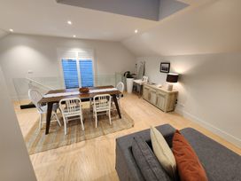 A dining room with a table and chairs at Studio - Point Wells Holiday Home in Point Wells