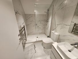 A bathroom with shower, toilet, and sink at Studio - Point Wells Holiday Home in Point Wells