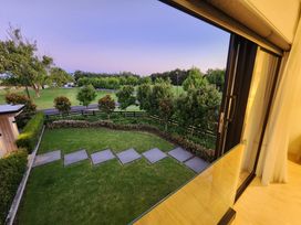 A view of a garden with pathway and trees at Studio - Point Wells Holiday Home in Point Wells