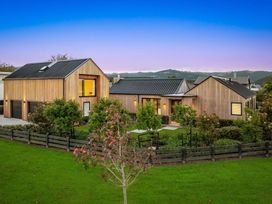 A house with a garage and trees surrounding at Studio - Point Wells Holiday Home Point Wells