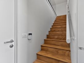 Stairs and handrail in a staircase at The Coastal Studio - Point Wells Holiday Home Point Wells