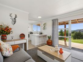 A living room with a couch and coffee table at Limesprings Cottage - Milton