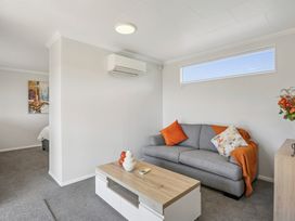 A living room with a sofa and coffee table at Limesprings Cottage - Milton