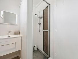 A bathroom with a shower and sink at Limesprings Cottage - Milton