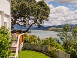 A view of the water and mountains from a deck at Panoramic Views on Paku - Tairua Family Retreat Tairua