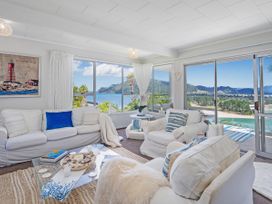 A living room with a view at Panoramic Views on Paku - Tairua