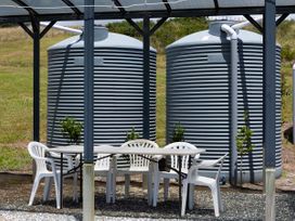 An outdoor area with water tanks and seating at Coopers Beach