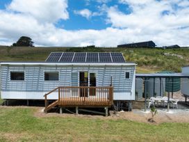 An outdoor area with a deck and water tanks at Coopers Beach