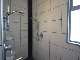 A shower with a window in the bathroom at Relax on Richmond - Taranaki Holiday Home, New Plymouth
