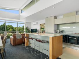 A kitchen with a large island and modern appliances at Lake Taupo Holiday Home, Taupo