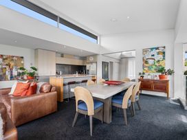 A dining room with a table and chairs at Lake Taupo Holiday Home, Taupo
