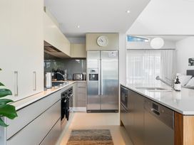 A kitchen with appliances and countertops at Lake Taupo Holiday Home in Taupo