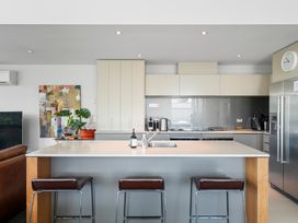 A kitchen with appliances and a sink at Lake Taupo Holiday Home in Taupo