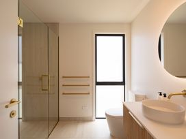 A bathroom with a shower and sink at Sunderland Views - Clyde Holiday Home, Clyde