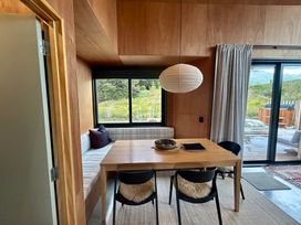 A dining room with a table and chairs at Cedarwood Retreat - Castle Hill