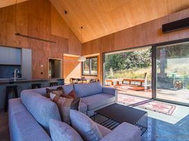 A living room with a sofa and coffee table at Cedarwood Retreat - Castle Hill