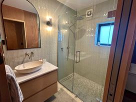 A bathroom with a shower and sink at Cedarwood Retreat - Castle Hill