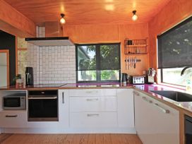 A kitchen with appliances and cabinets at New Plymouth in New Plymouth
