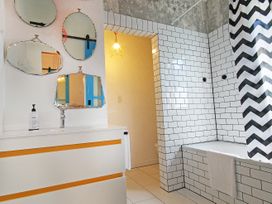 A bathroom with a sink and bathtub at New Plymouth in New Plymouth