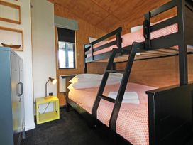 A bedroom with a bunk bed and a nightstand at New Plymouth in New Plymouth