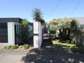 A gate with plants at the entrance of a property at New Plymouth