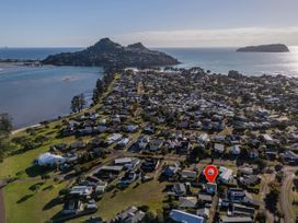 An aerial view of houses near water at Pauanui Holiday Home in Pauanui