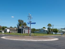 A road intersection with a roundabout and street signs at Hawksie Place, Reporoa