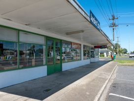 A storefront with windows and sign at Awaken Cafe in Reporoa