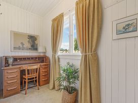 An office with a desk and chair at Kettle House - Upper Moutere Holiday Home