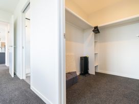 A closet with shelves and a radiator at Oraka Scenery - Te Anau Holiday Home in Te Anau