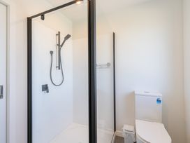 A bathroom with a shower and a toilet at Oraka Scenery - Te Anau Holiday Home, Te Anau