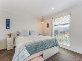 A bedroom with a bed and window at Nelson in Richmond