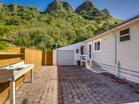 An outdoor area with paving stones and a garage at Pacific Vista - Hawkes Bay Havelock North