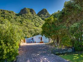 A house with a driveway and trees at Pacific Vista - Hawkes Bay in Havelock North