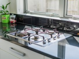 A gas stove on a kitchen countertop at Sweet As on Aquila - Whitianga Holiday Home, Whitianga