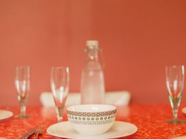 A table setting with a bowl and glasses at The Schieck Shack - Whitianga