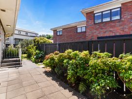A garden area with plants and pathway at Moana - Onehunga Holiday Home Auckland