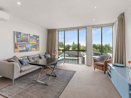 A living room with a sofa and coffee table at Lake Taupo Holiday Home Taupo